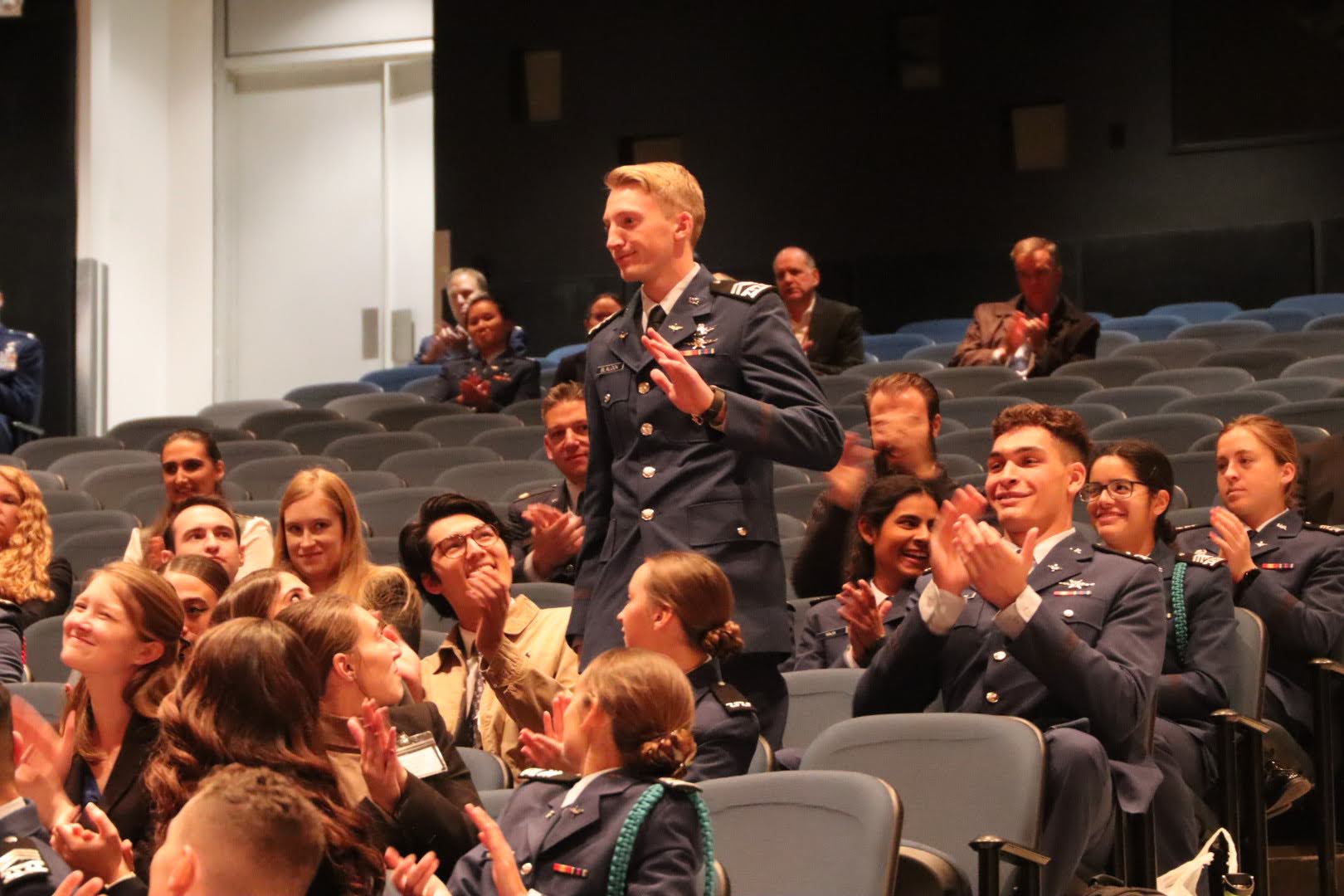 Thomas Blalock receiving a research award at USAFA, 2023.